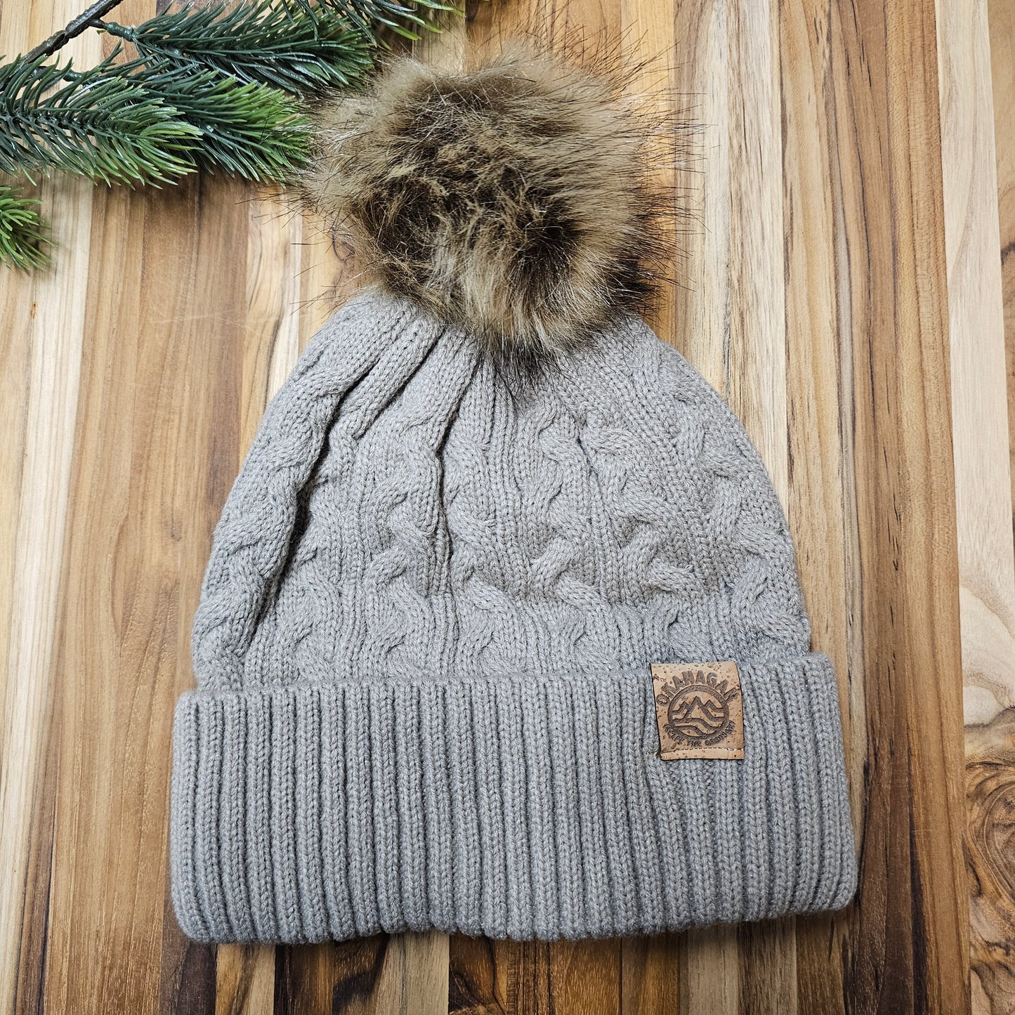 Okanagan Wave Cable Knit Toque in Oatmeal with Faux Fur Pom and Cork Patch - Republic West