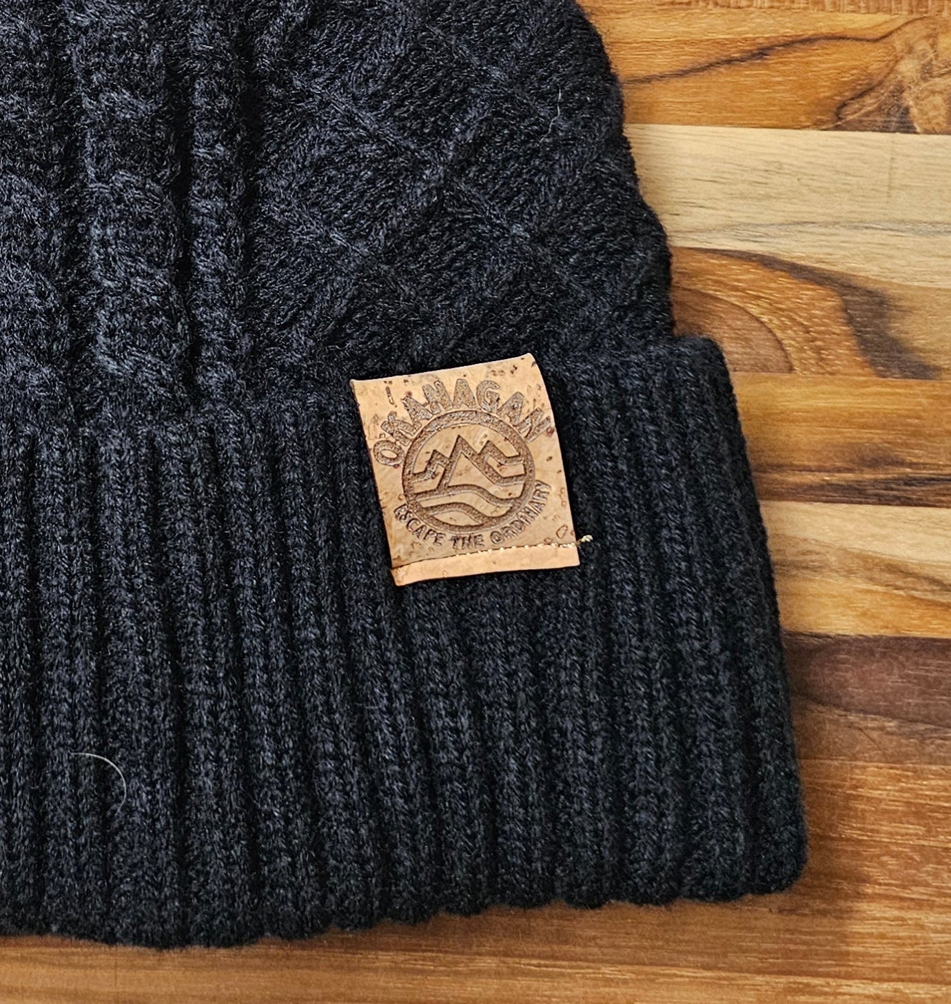 Okanagan Wave Cable Knit Toque with Faux Fur Pom and Cork Patch