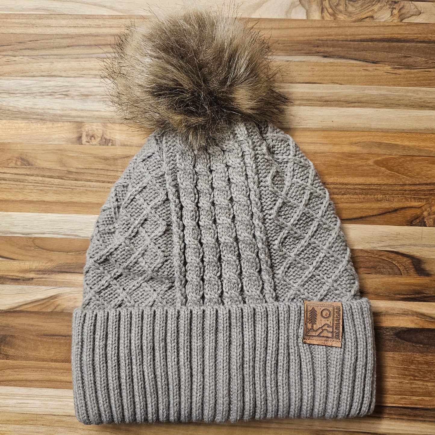Okanagan Wild Cable Knit Toque with Faux Fur Pom and Cork Patch - Oatmeal