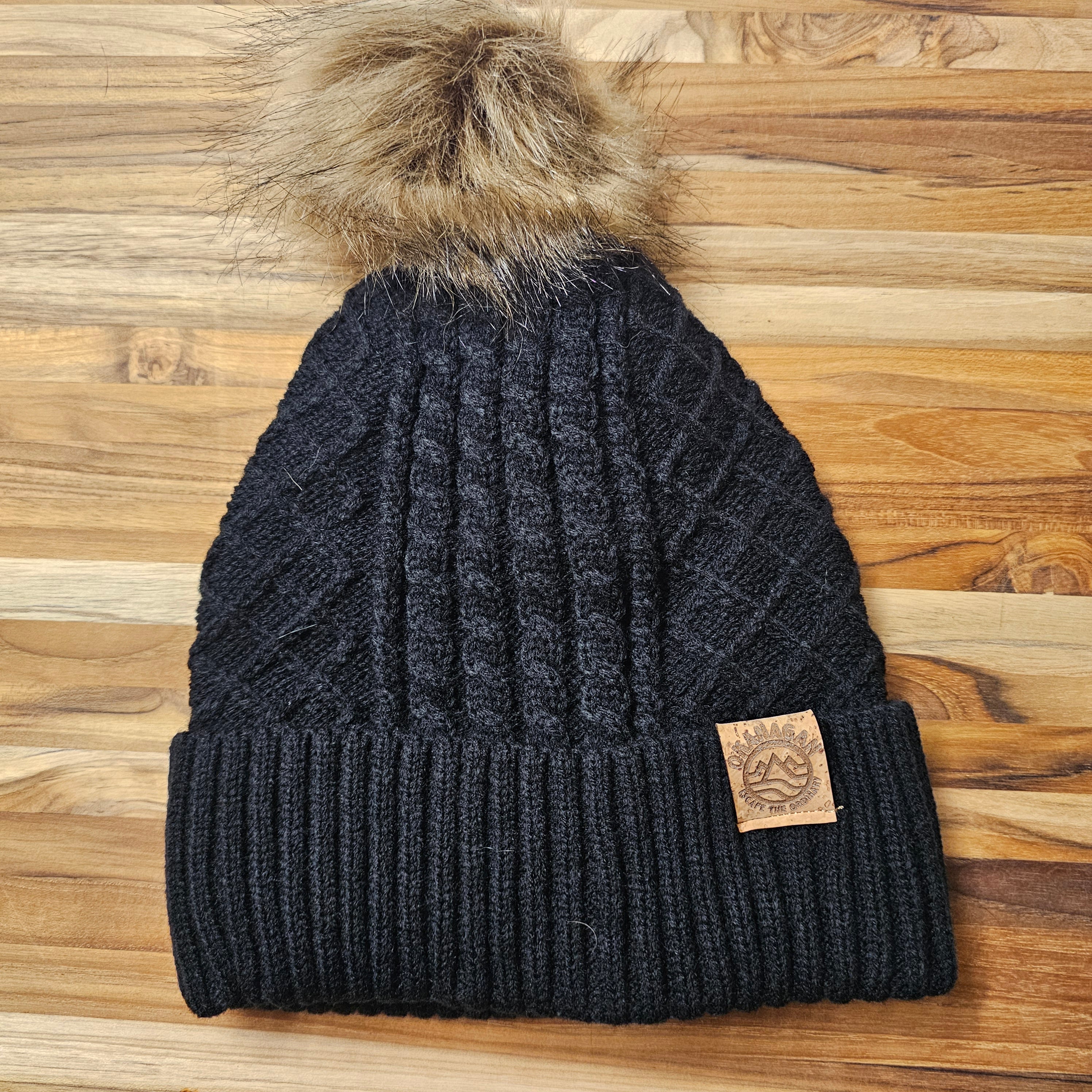 Okanagan Wave Cable Knit Toque with Faux Fur Pom and Cork Patch ...